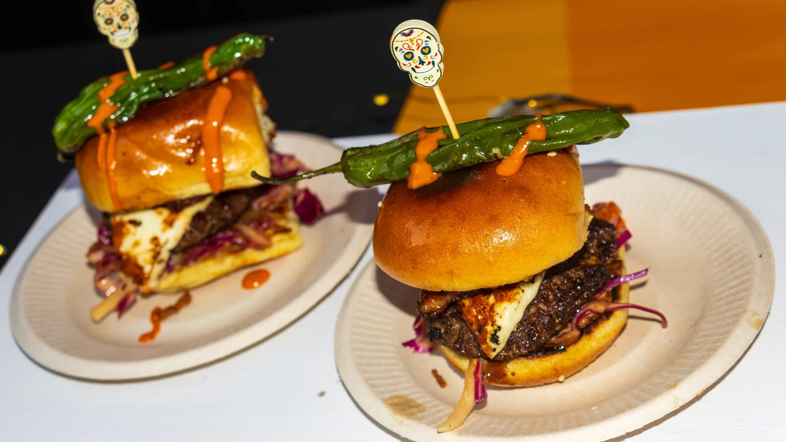 Gourmet sliders topped with blistered peppers