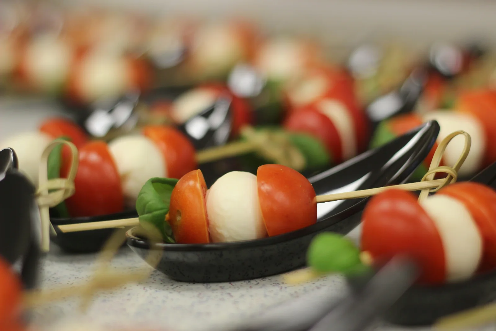 Caprese skewers of tomato, mozzarella, and basil