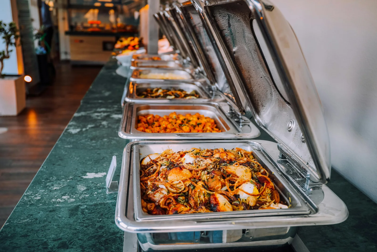 A chafing-dish buffet line of freshly made dishes