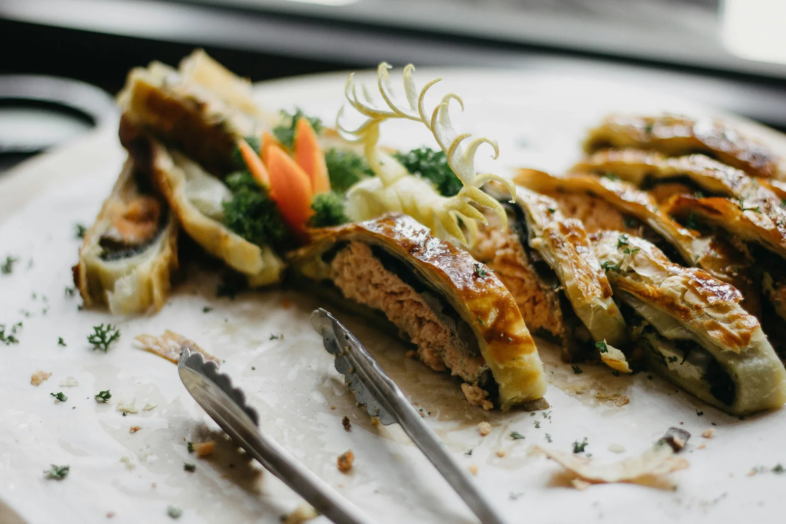 A sliced en croute platter, plated and garnished