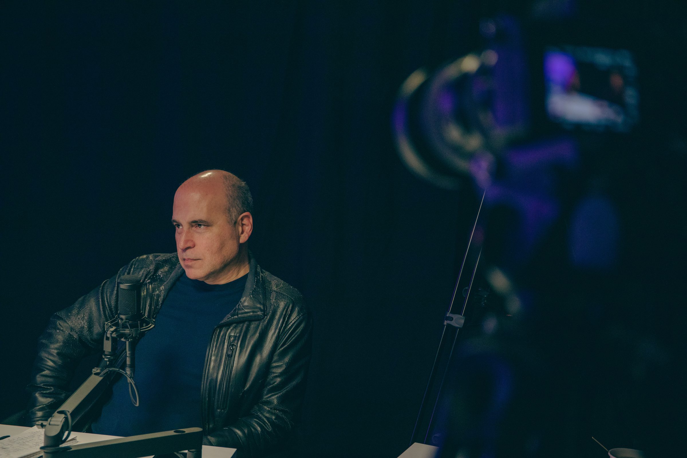 Guest at a microphone during a studio livestream in San Antonio