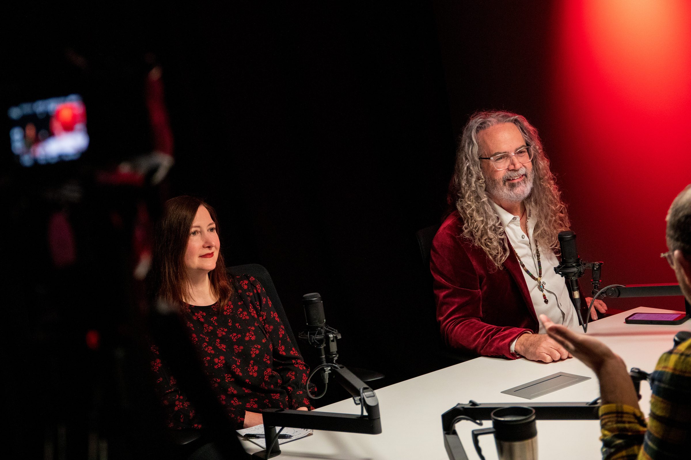 Multi-person panel being livestreamed in a studio