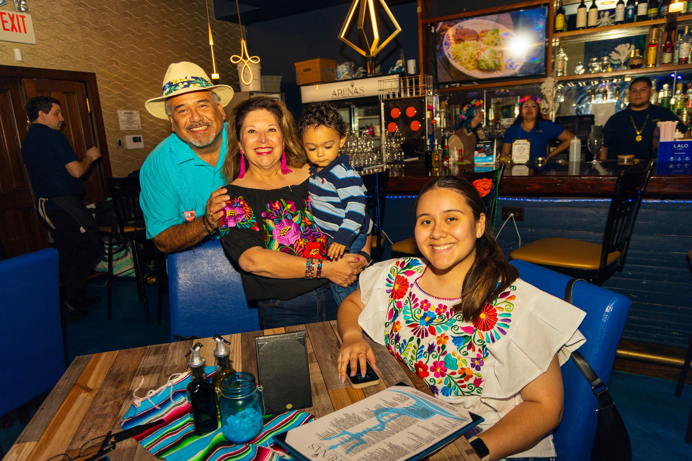Family celebrating at a San Antonio restaurant event